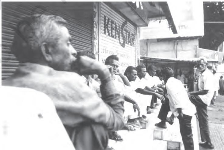 Fig. 6.5 Unemployed mill workers waiting for casual jobs