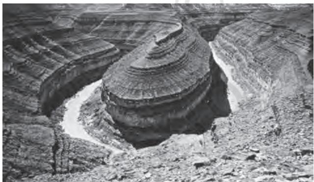 Figure 6.2 : An entrenched meander loop of river Colorado in USA showing step-like side slopes of its valley typical of a canyon