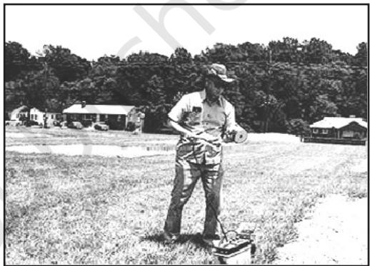 Fig. 1.2 : Field Scientist taking Measures of Crop Health