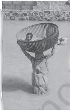 AND THEY SAY IT'S A DESERTIn the Times of Adversity : A woman carries her child to safety in the flooded Kudla village of Rajasthan's Barmer district