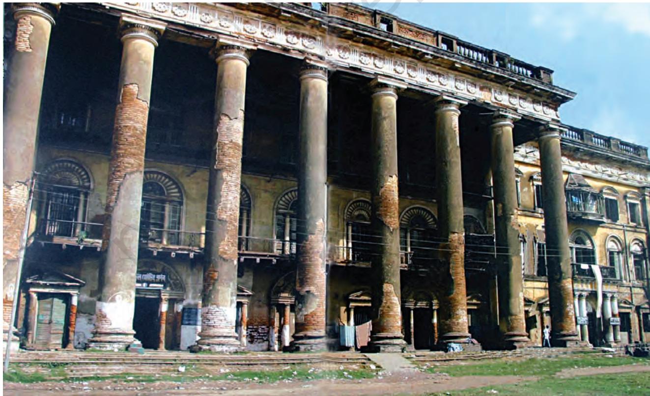 Fig. 9.7
Andul Raj Palace
The ruins of palaces are a visible sign of the end of an era. Satyajit Ray's famous film Jalshaghar, on the decline of the aristocratic zamindari style of living, was shot in Andul Raj Palace.groups in Britain who were opposed to the monopoly that the East India Company had over trade with India and China. These groups wanted a revocation of the Royal Charter that gave the Company this monopoly. An increasing number of private traders wanted a share in the India trade, and the industrialists of Britain were keen to open up the Indian market for British manufactures. Many political groups argued that the conquest of Bengal was benefiting only the East India Company but not the British nation as a whole. Information about Company misrule and maladministration was hotly debated in Britain and incidents of the greed and corruption of Company officials were widely publicised in the press. The British Parliament passed a series of Acts in the late eighteenth century to regulate and control Company rule in India. It forced the Company to produce regular reports on the administration of India and appointed committees to enquire into the affairs of the Company. The Fifth Report was one such report produced by a Select Committee. It became the basis of intense parliamentary debates on the nature of the East India Company's rule in India.