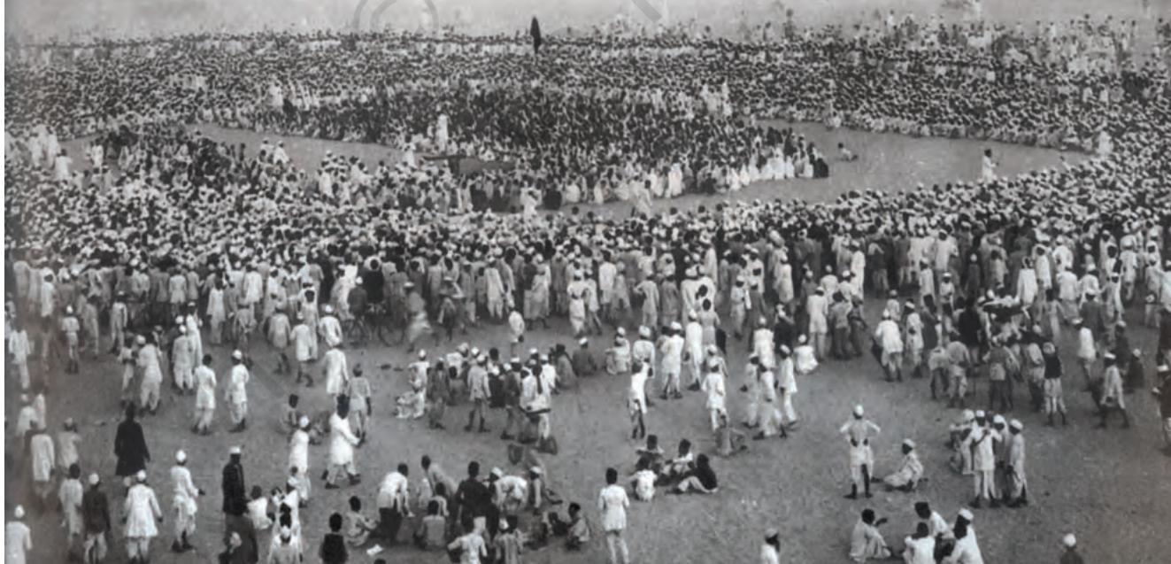 Fig. 11.1
People gather on the banks of the Sabarmati River to hear Mahatma Gandhi speak before starting out on the Salt March in 1930