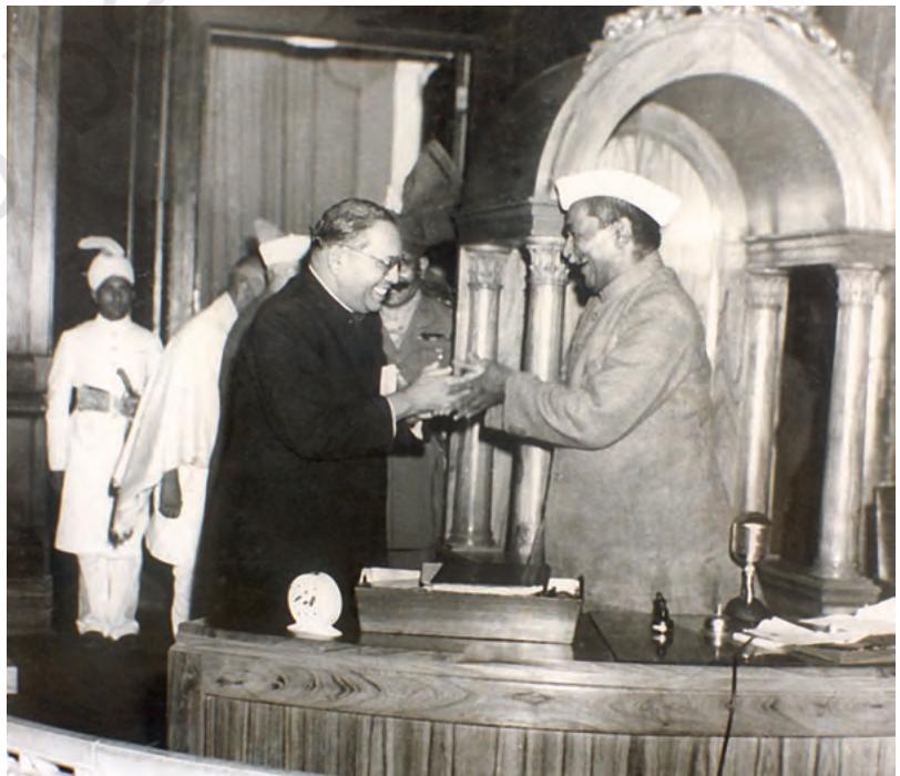 Fig. 12. 9
B. R. Ambedkar and Rajendra Prasad greeting each other at the time of the handing over of the Constitution